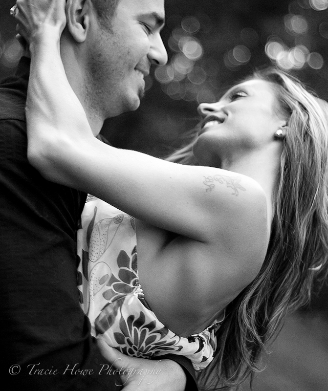 Portrait of engaged couple twirling