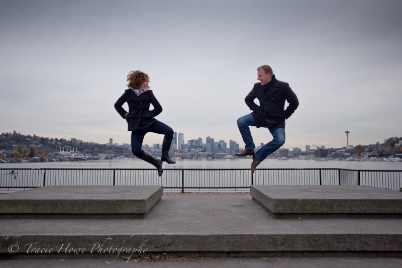 photo of engaged couple jumping at Gasworks Park