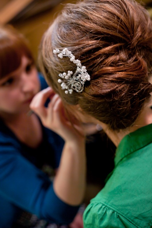 Photo of bride getting makeup done