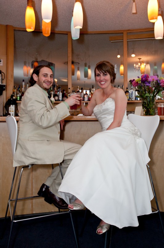 Photo of bride and groom cheers