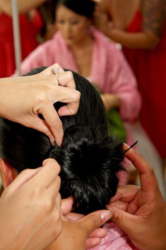 Photo of bride getting hair done