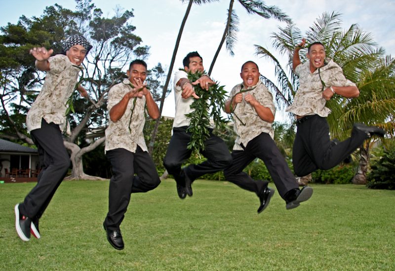 Photo of groom and groomsmen jumping in Hawaii
