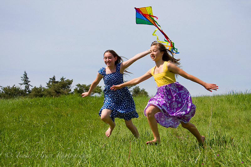 Portrait of little girls and a kite at Discovery park