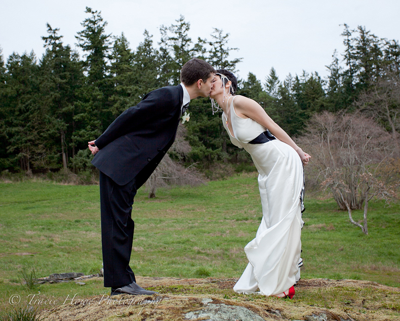 Photo of bride and groom kissing on Orcas Island