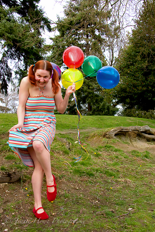 Portrait of woman with balloons