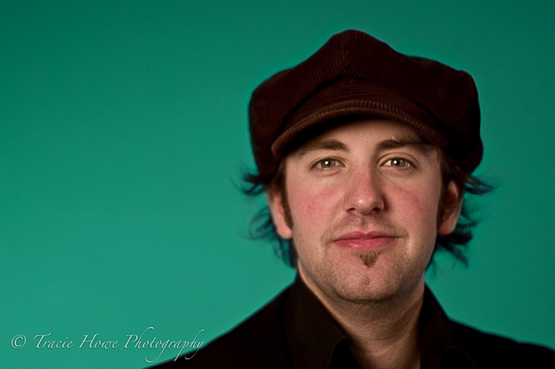 Portrait of man with a green background