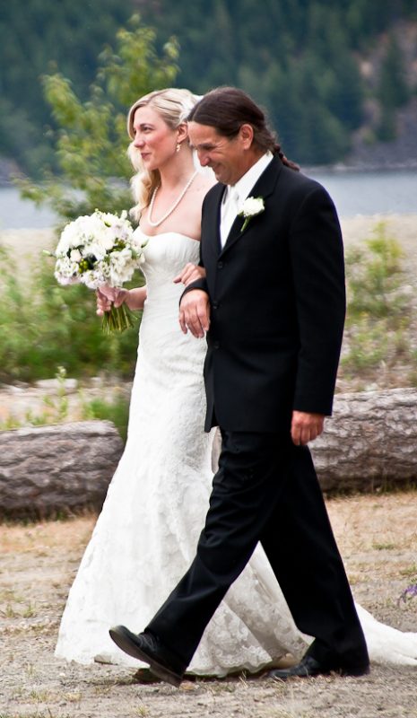 Photo of father walking the bride down the aisle