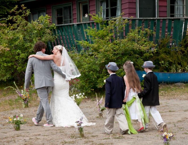 Photo of bride and groom walking on Vancouver Island