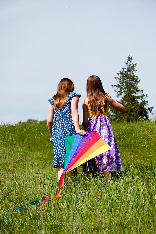 Portrait of little girls and a kite at Discovery park