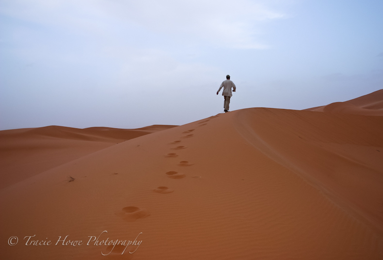 Man walking through Sahara Desert