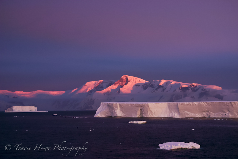 Photograph of iceberg and mountains in Antarctica