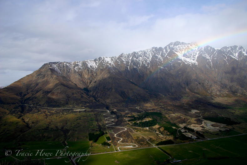 Photograph of rainbow over mountain landscape in New Zealand