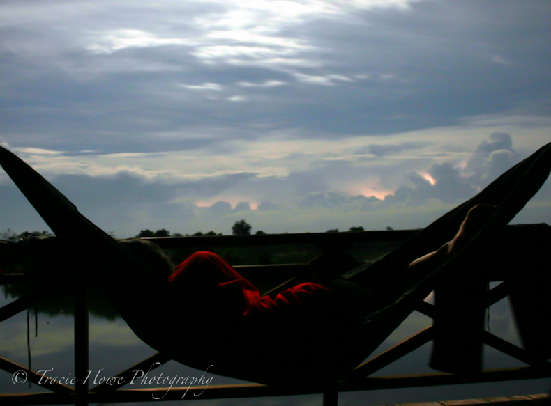 Silhouette of woman in hammock