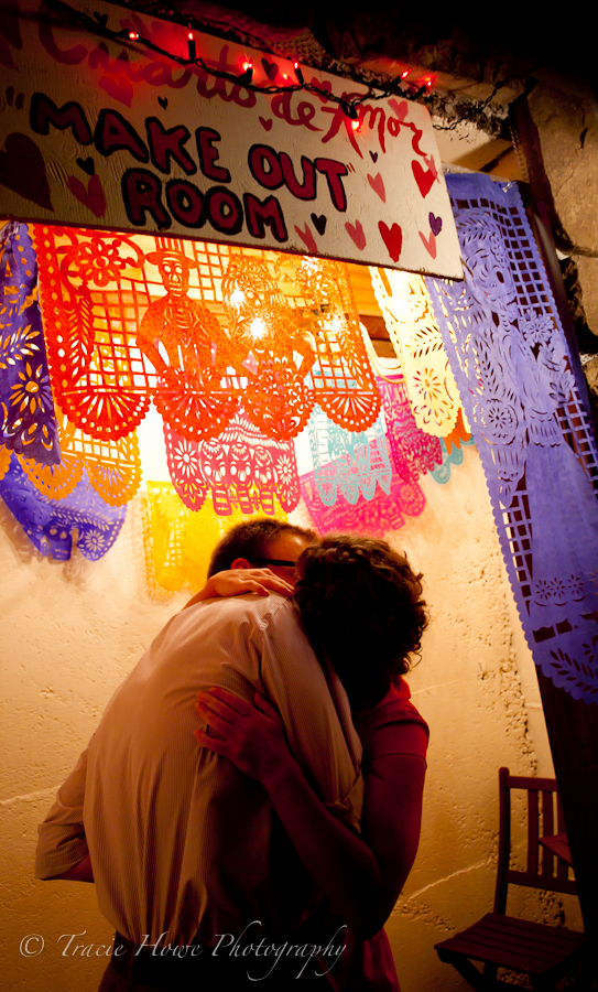 Photo of couple kissing in make out room at wedding