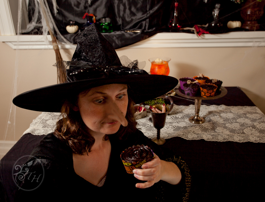 Photo of witch eating cupcake from a Halloween themed self-portrait