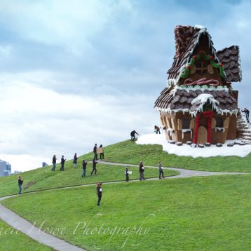Forced perspective photo of giant gingerbread house on hill at Gasworks Park