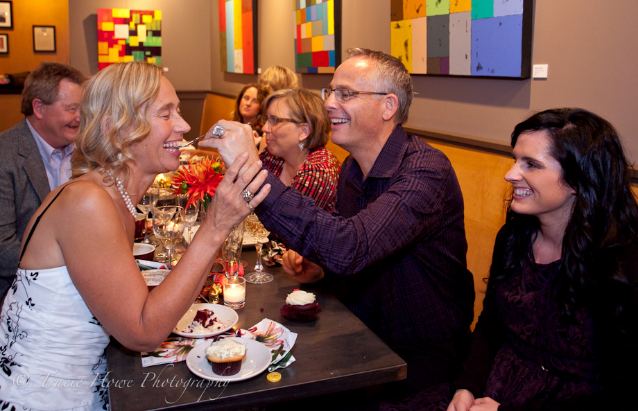 Photo of groom feeding bride at wedding in Seattle