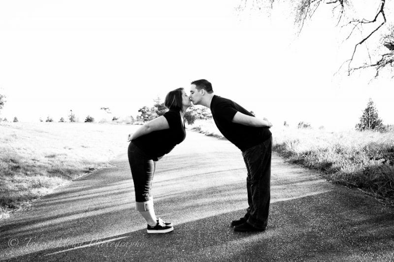 photo of Seattle engagement photography kiss - Discovery Park