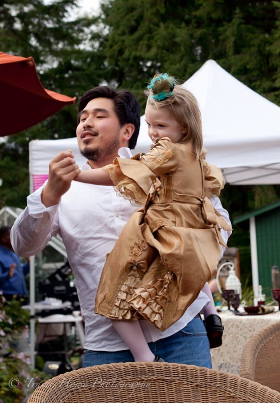 Cute photo of guy dancing with little girl at wedding