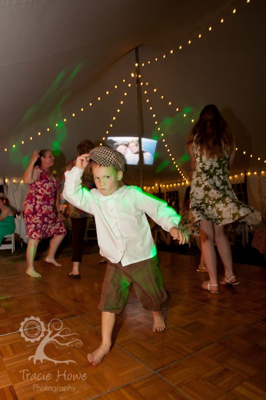 Cute boy dancing at wedding ceremony