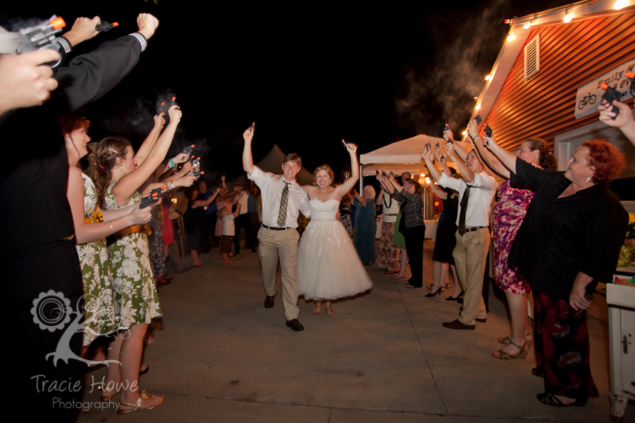 Bride and groom during a cap-gun send off