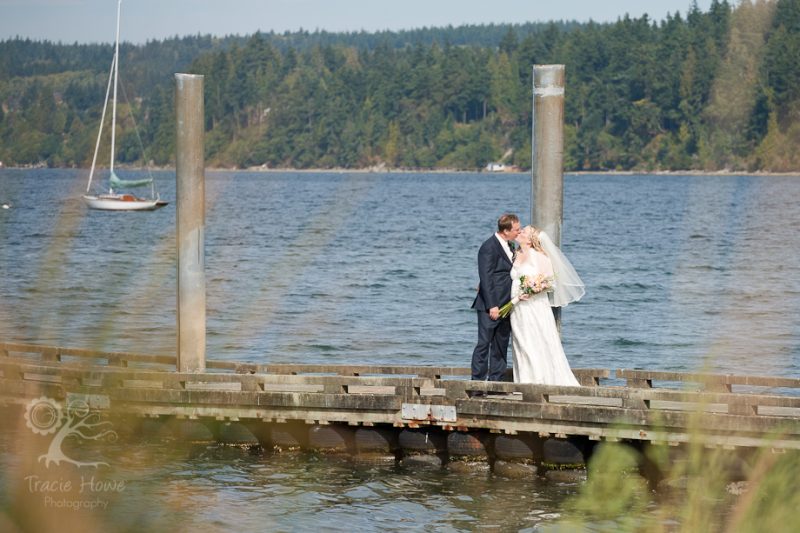 Bride and groom on dock - Freeland Hall -Whidbey Island