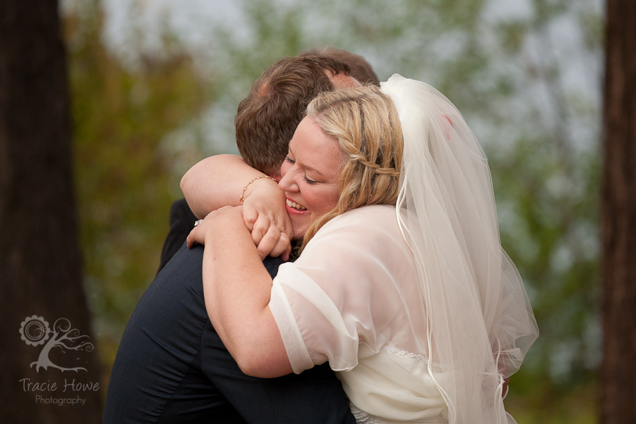 Photo of bride and groom hug
