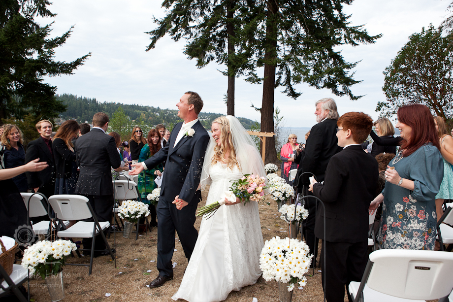 Photo of bride and groom in aisle