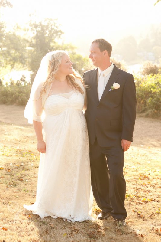 Photo of bride and groom backlit